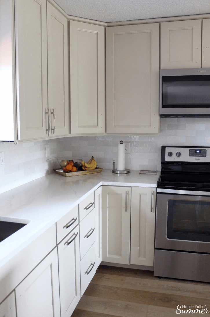 Benjamin Moore Balboa Mist featured on kitchen cabinets