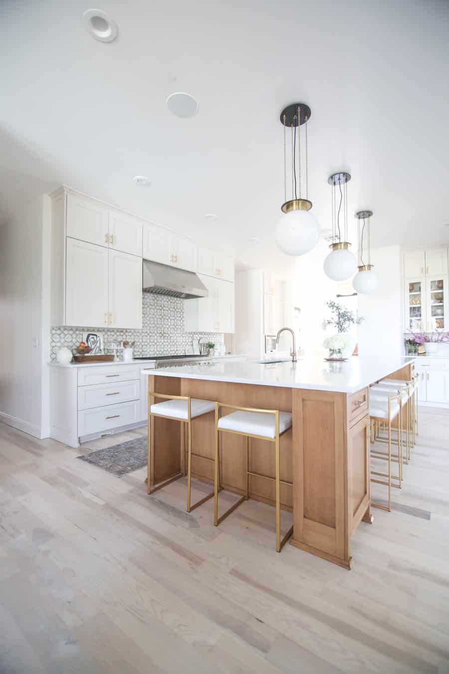 benjamin moore pale oak cabinets in a kitchen filled with natural light.