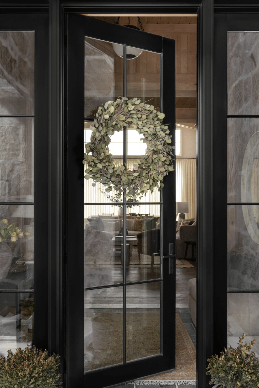 front black door with entryway rug.