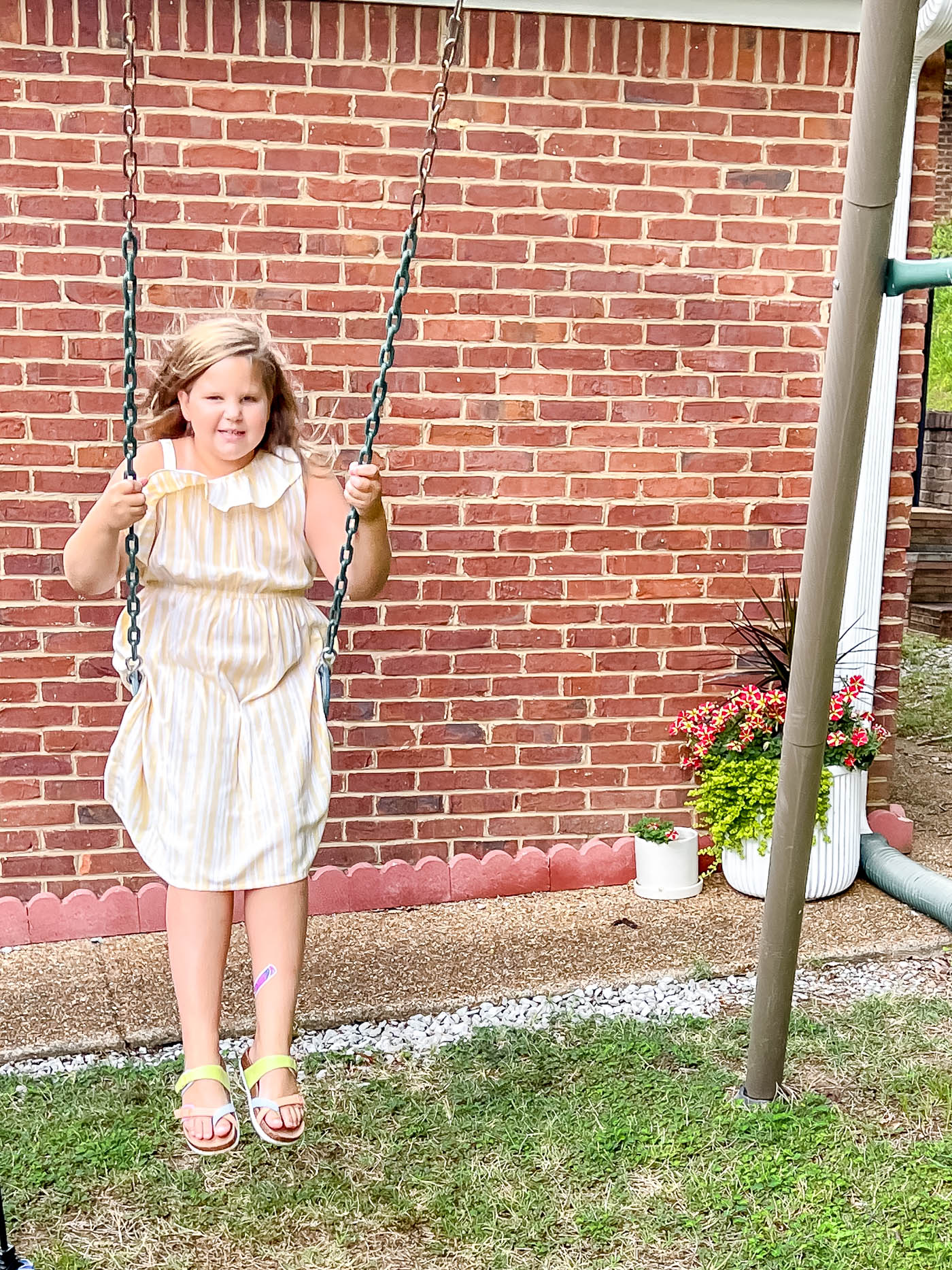 girl swinging in pretty dress