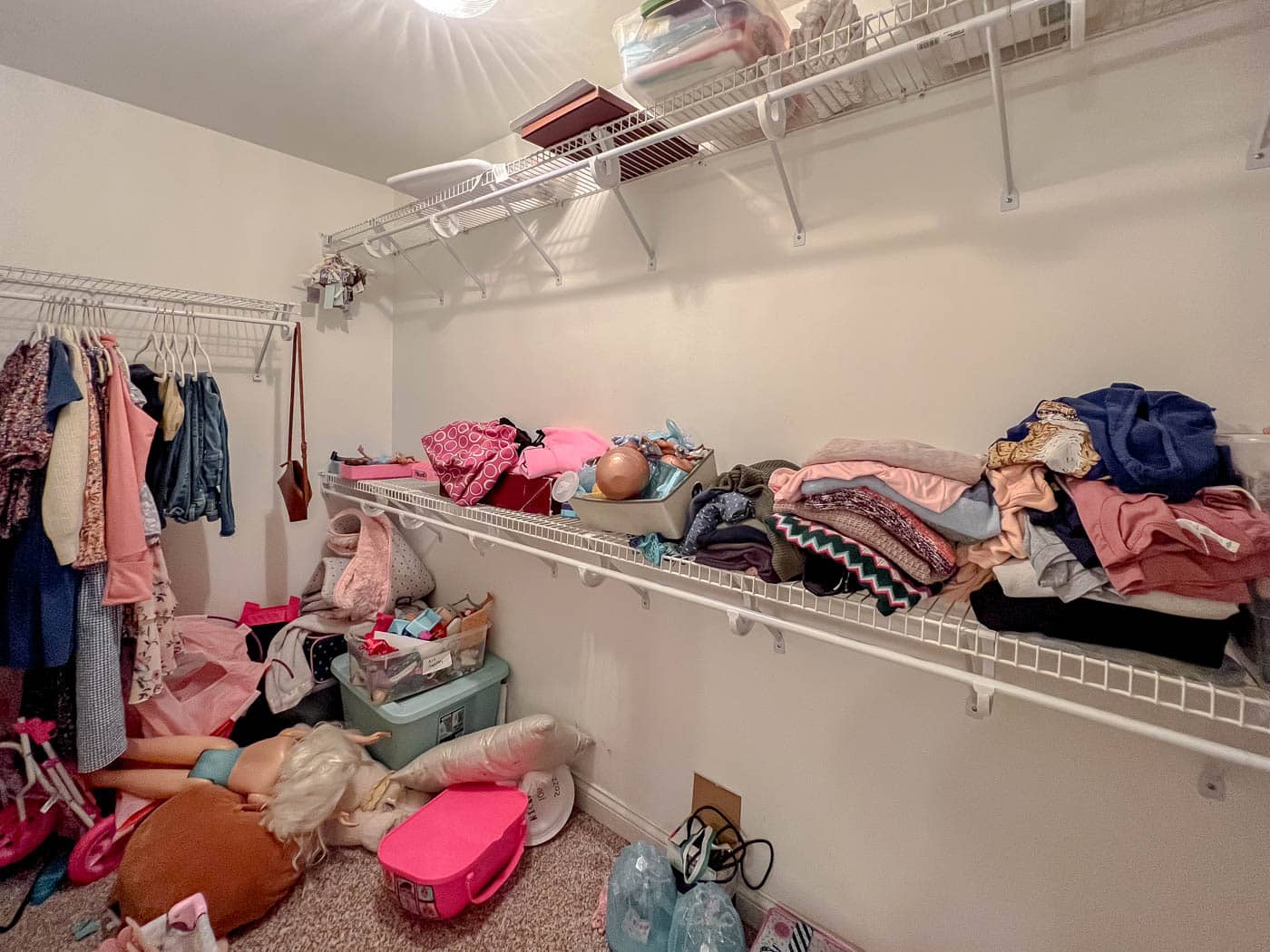 Underutilized wire shelves in walk-in closet