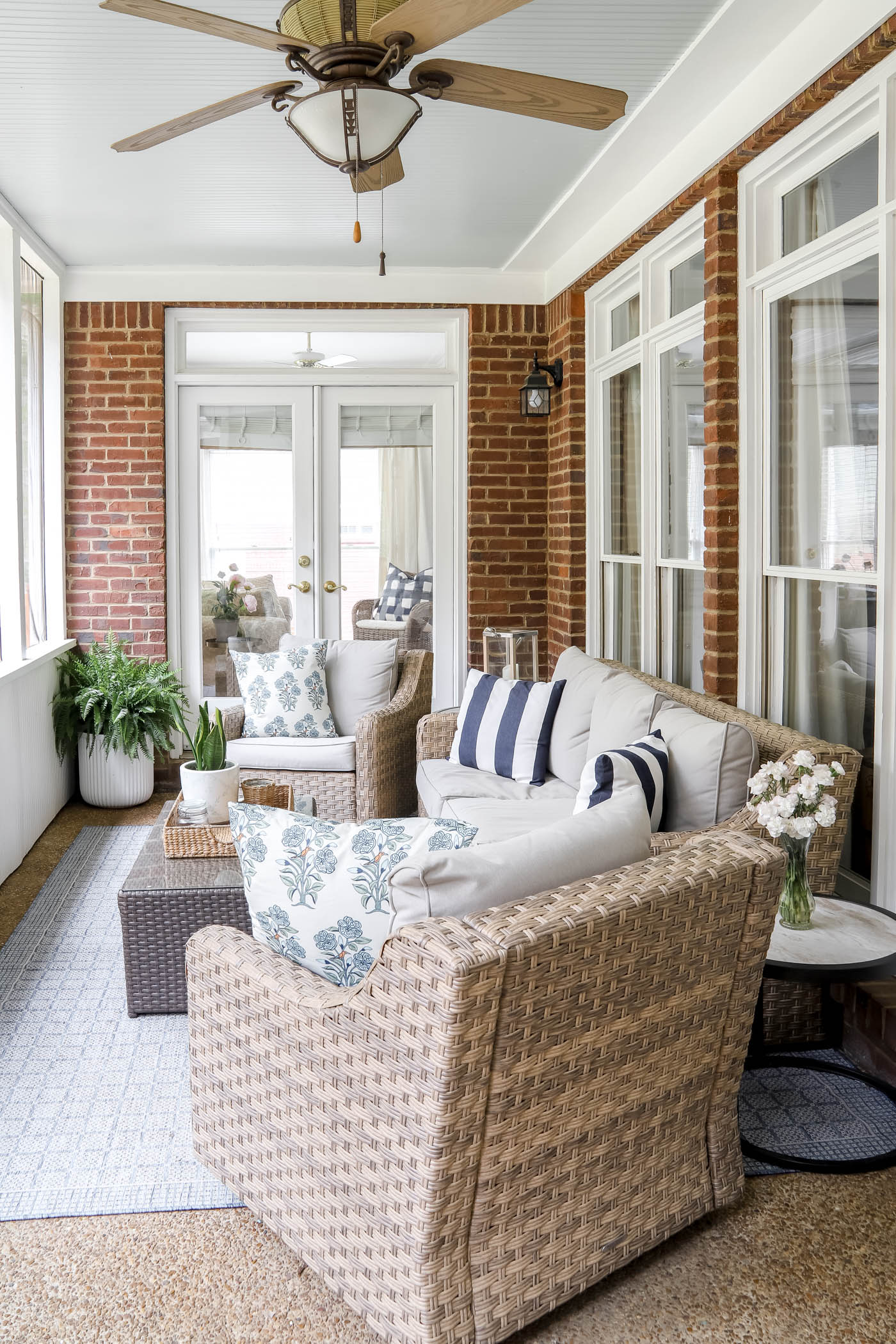 wicker patio furniture on screened-in porch
