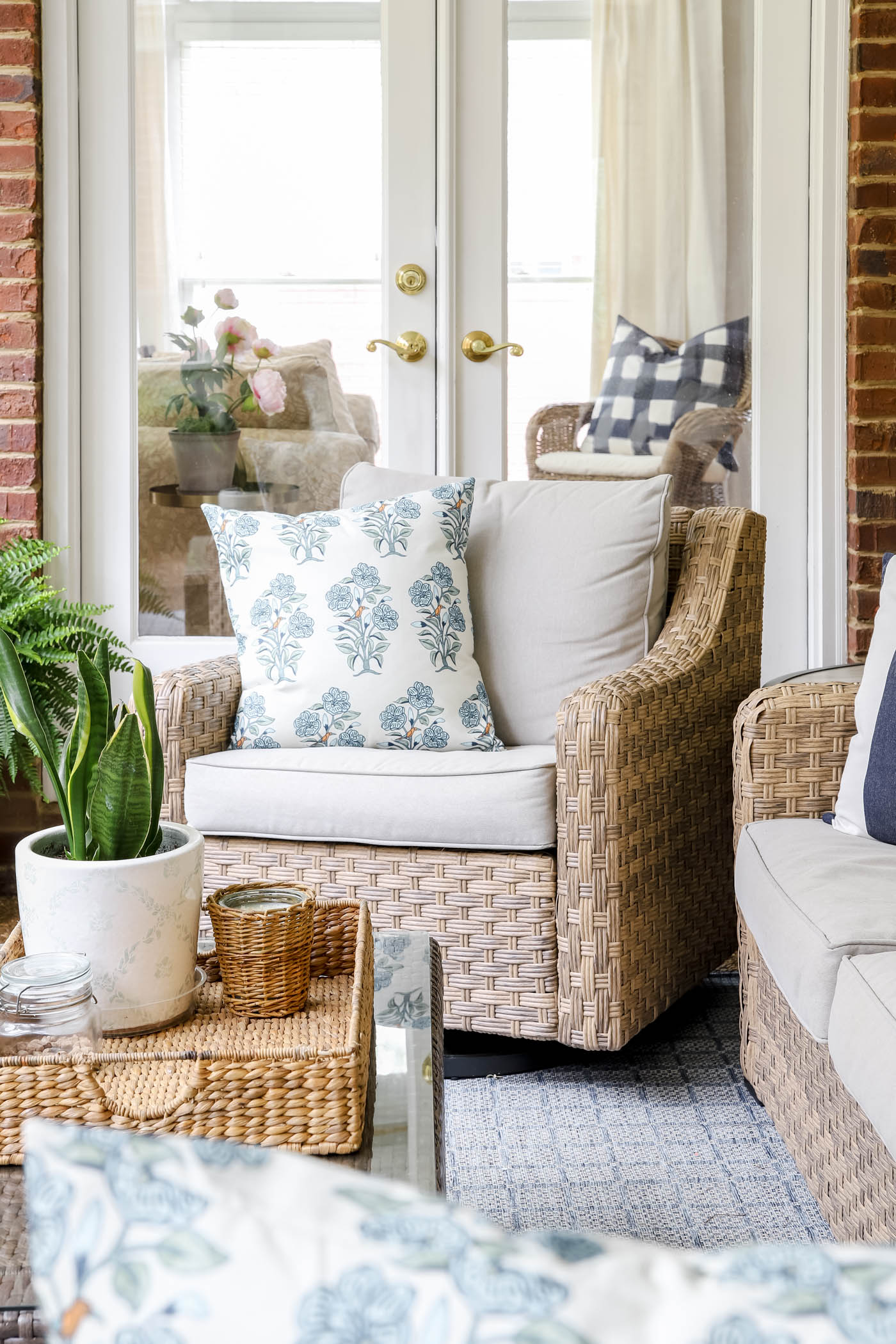 floral pillow covers on wicker patio furniture