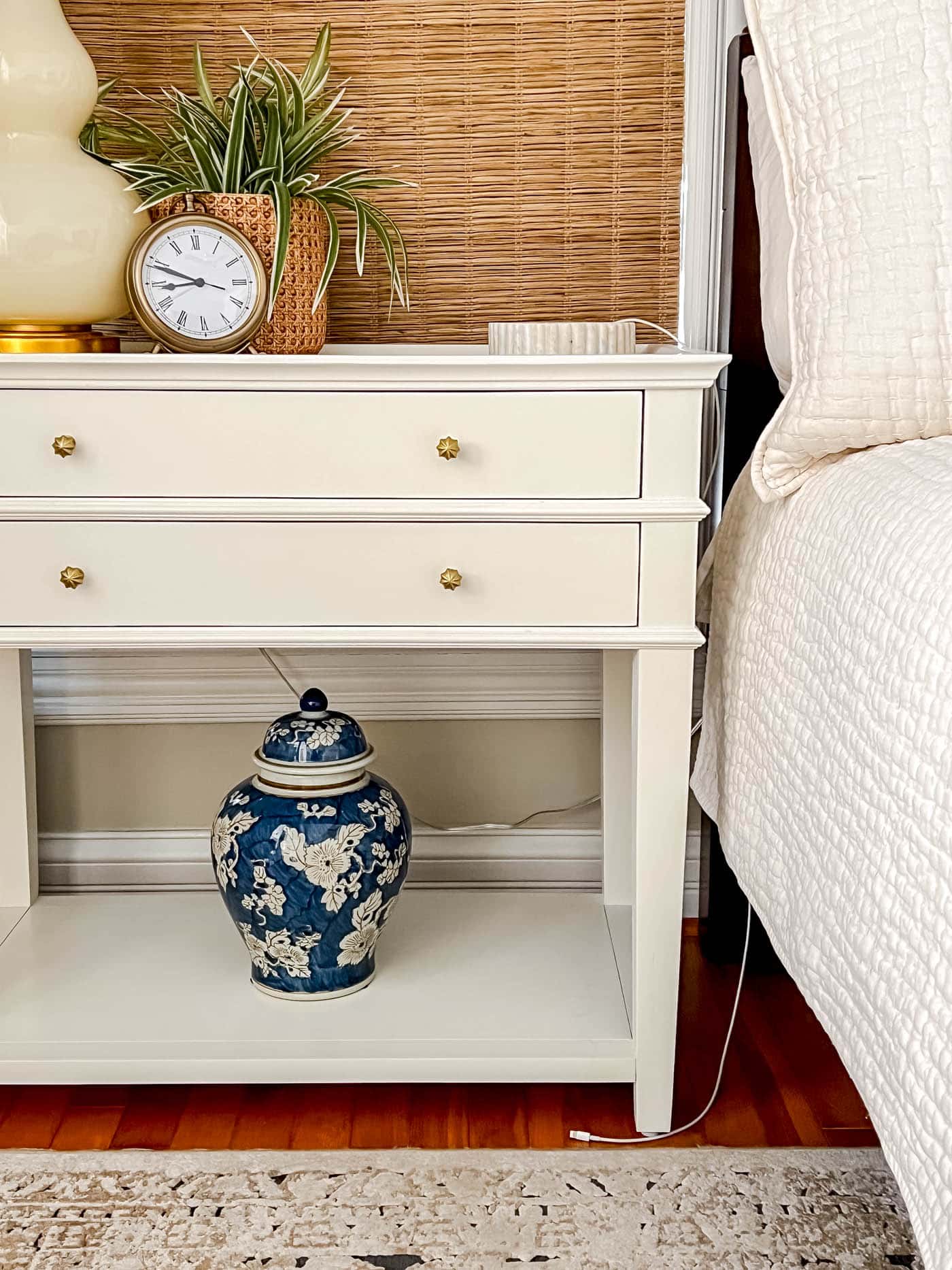 bedside table with messy cords