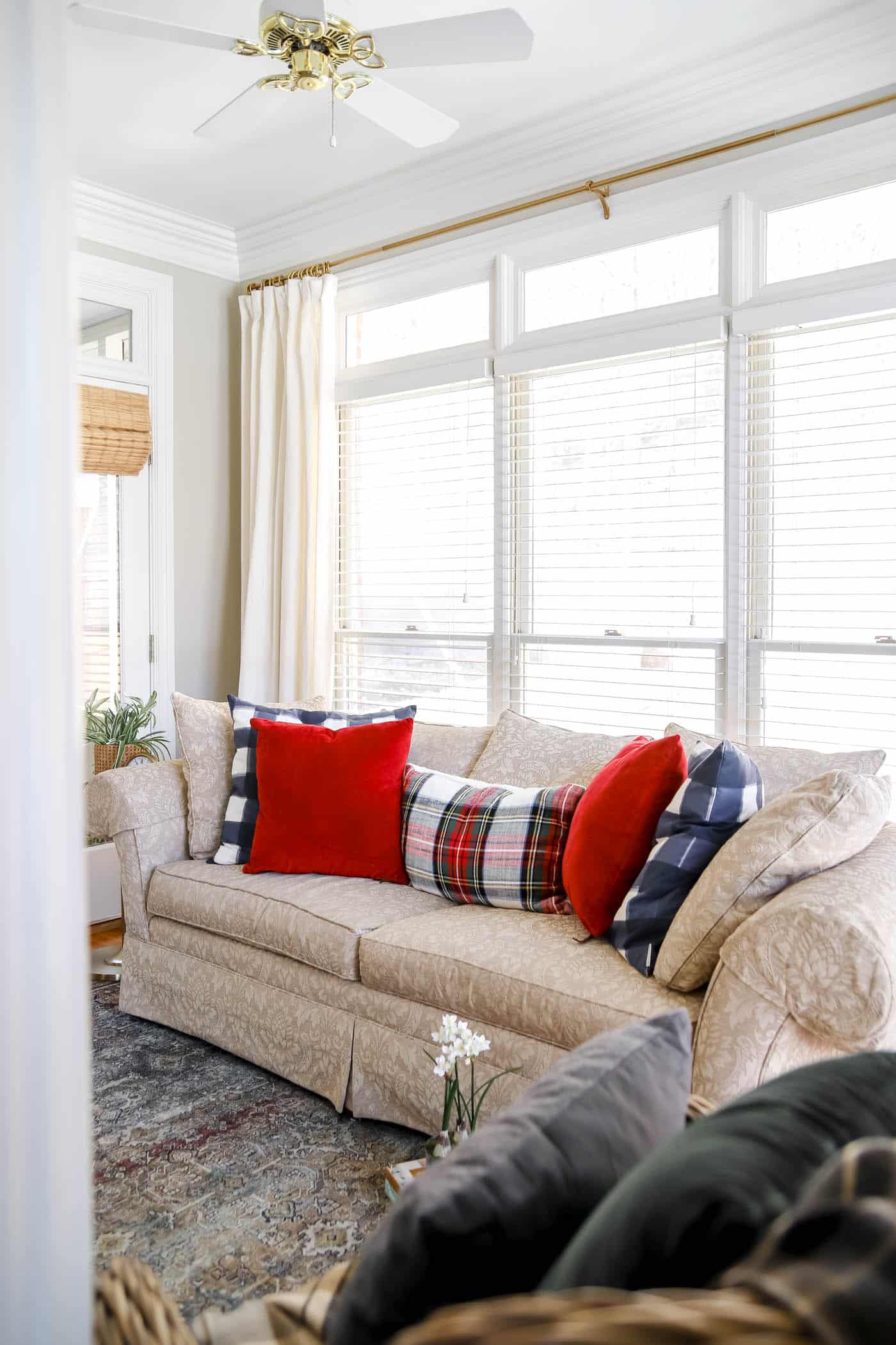 sitting room in bedroom with festive holiday pillows