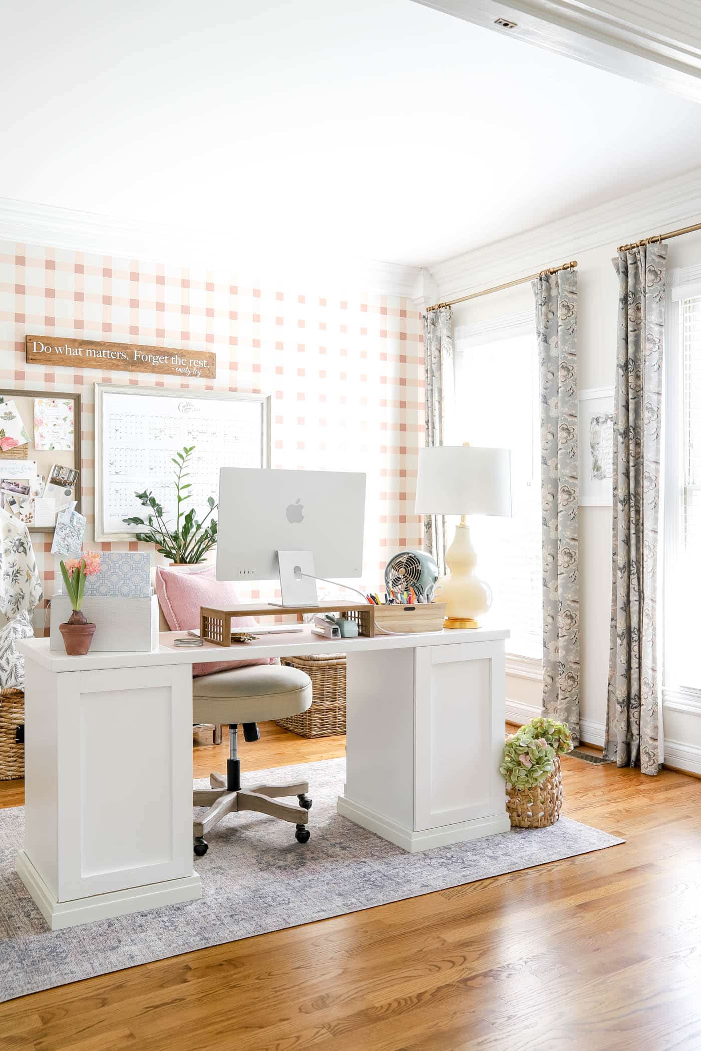 pink and white office with floating desk.