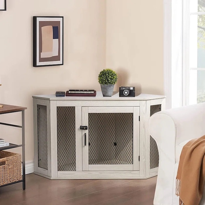 dog crate as a table in the corner of a living room.