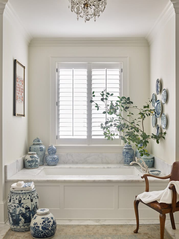 ginger jars next to bathtub