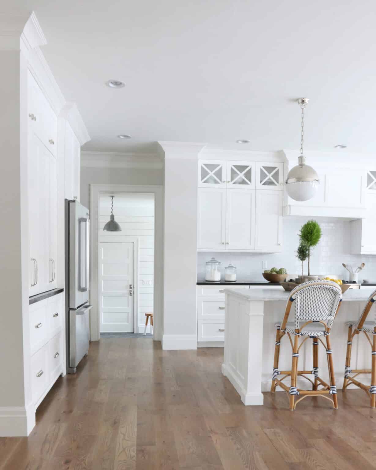 kitchen with Classic Gray walls and white cabinets