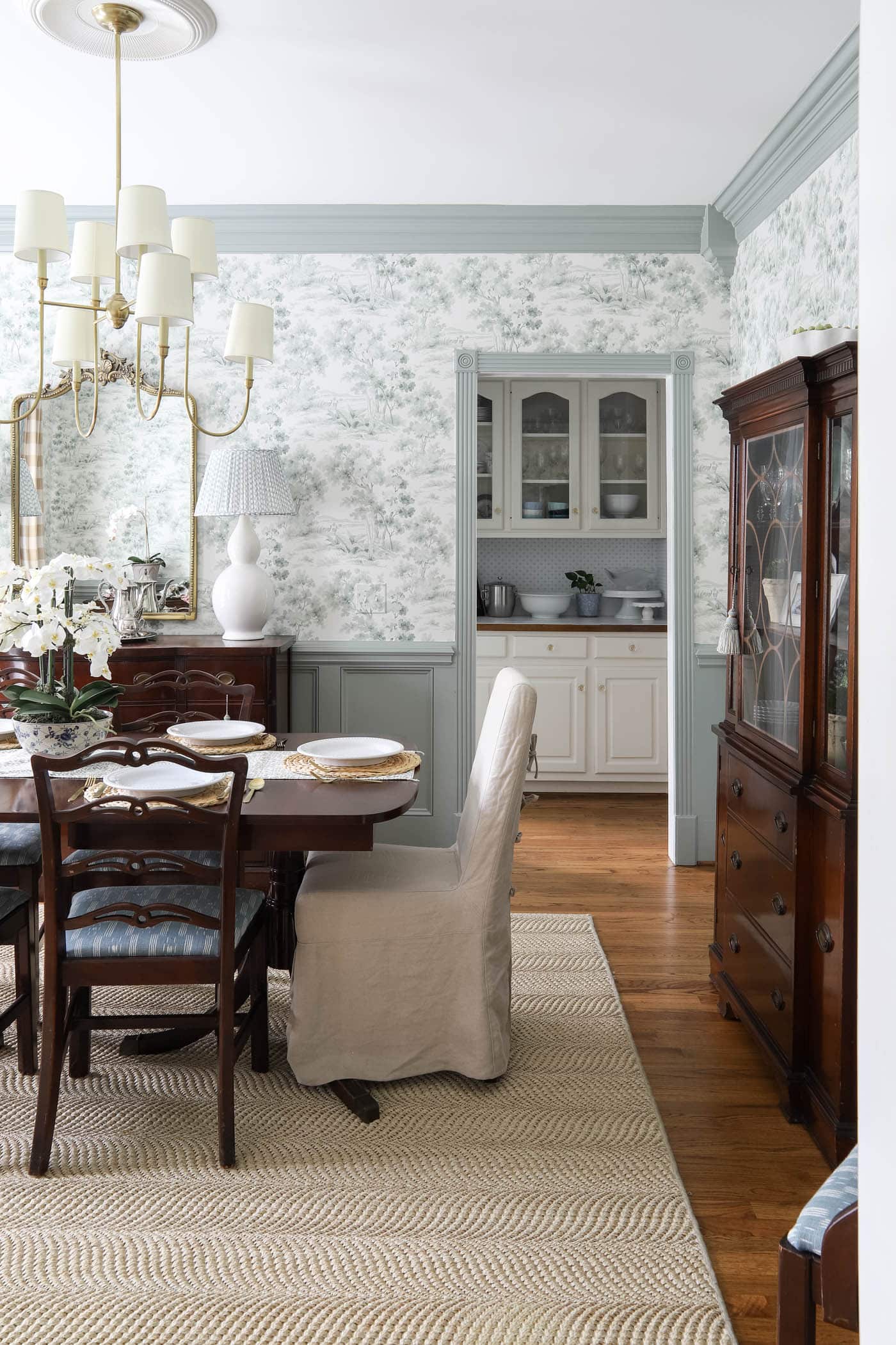 butler's pantry next to a traditional dining room.