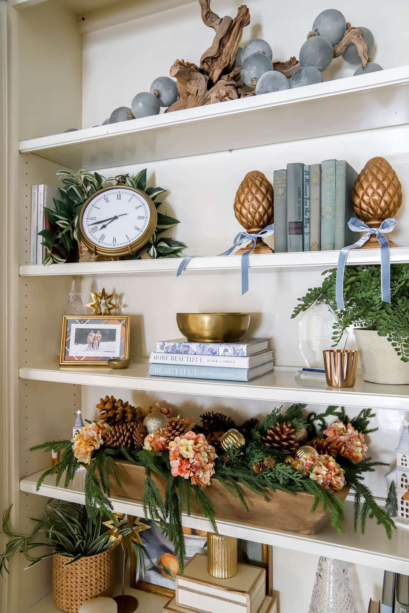 orange blue and copper Christmas shelf decor.