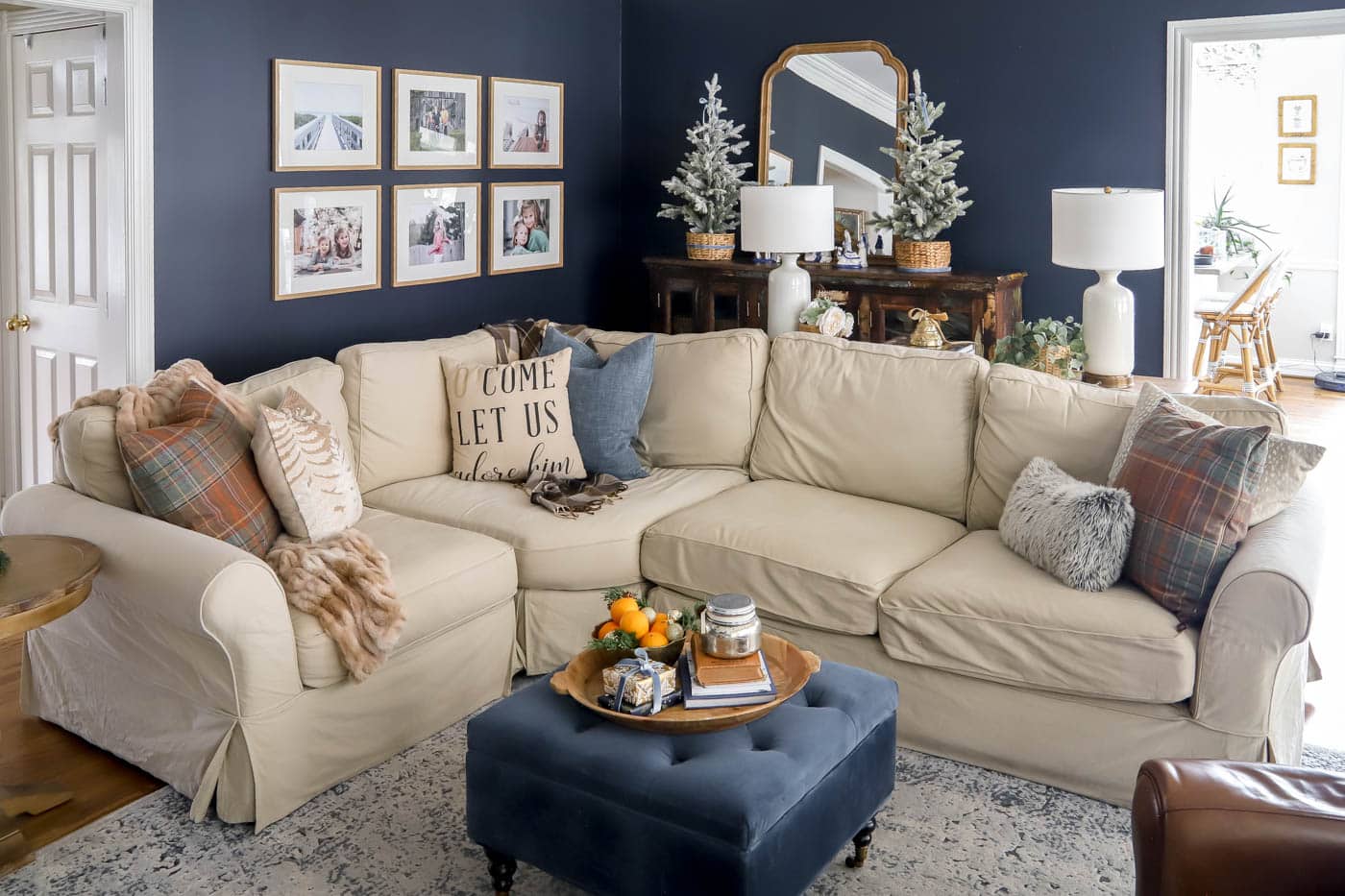 neutral sectional sofa with neutral Christmas pillows.