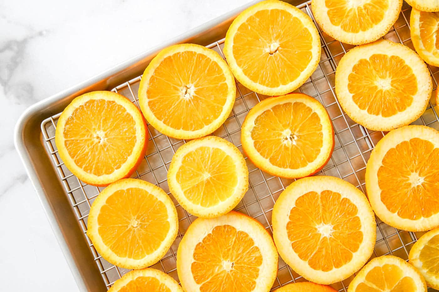 arrange oranges on a baking sheet.
