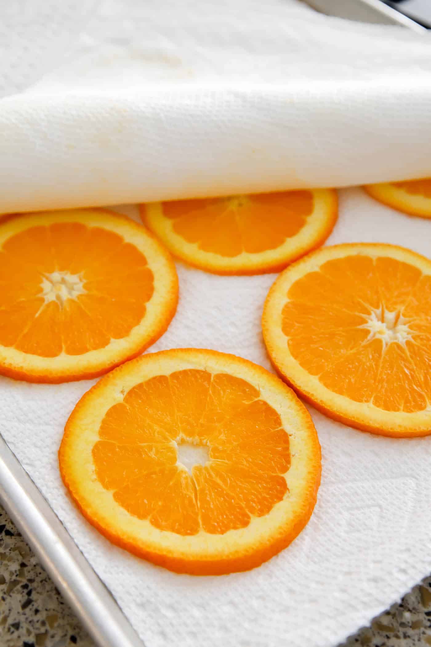 press moisture out of orange slices with paper towels