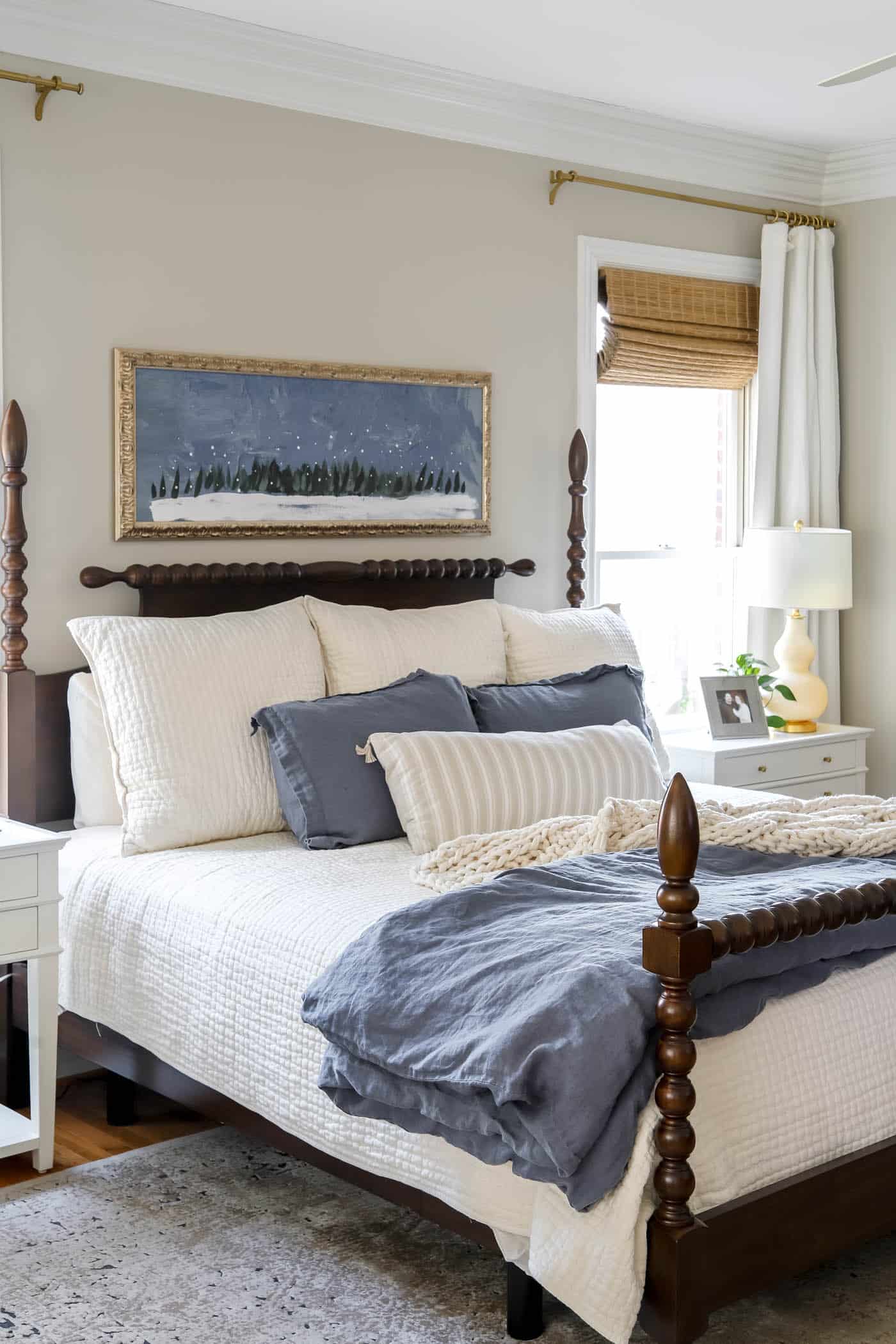 primary bedroom with winter art over the bed