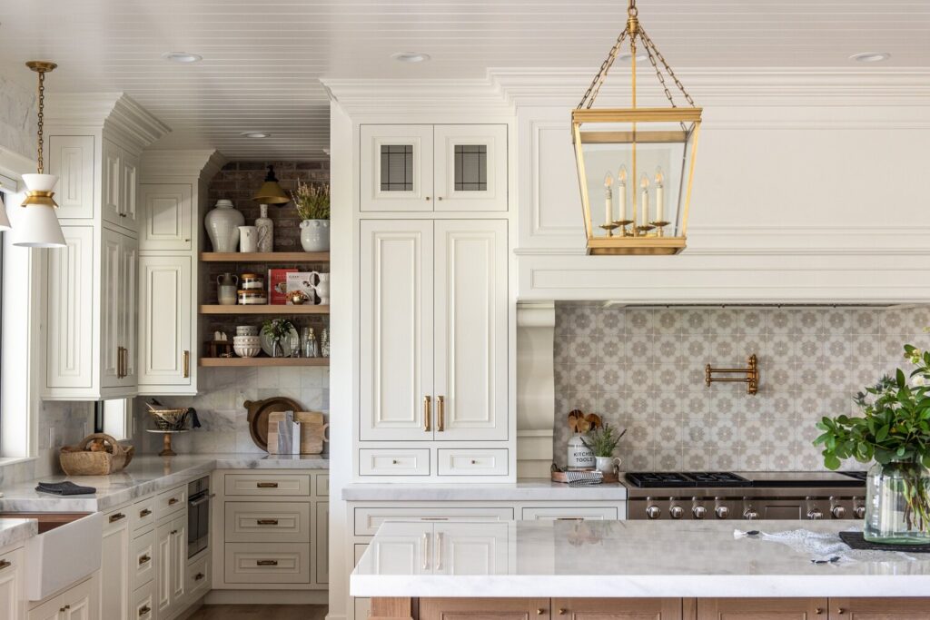 white dove kitchen cabinets with marble countertops.