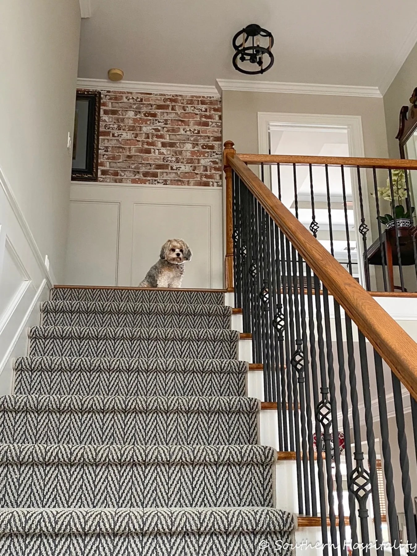 adding brick wallpaper in the stairwell.