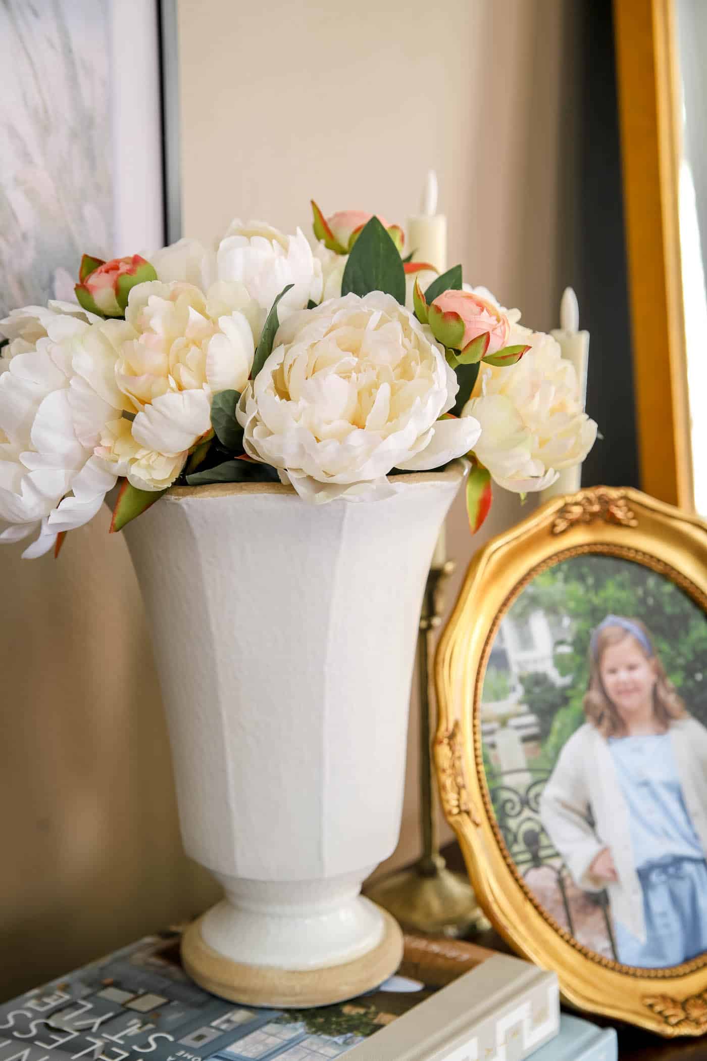 faux peony bouquet with ranunculus in a ceramic vase.