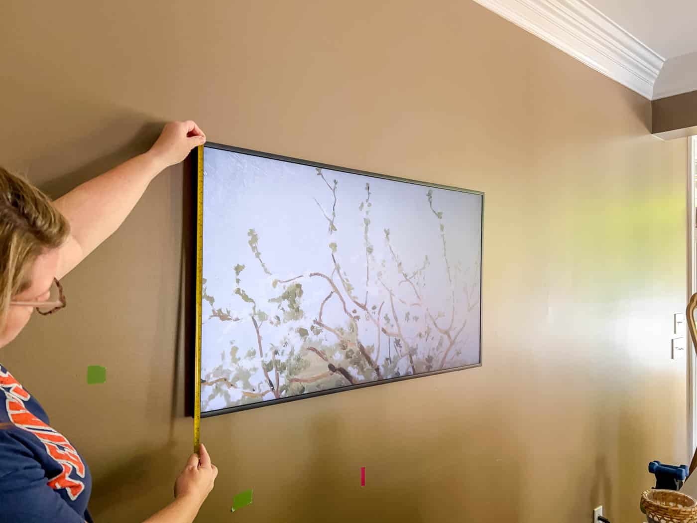 measuring the Frame TV to make a frame.