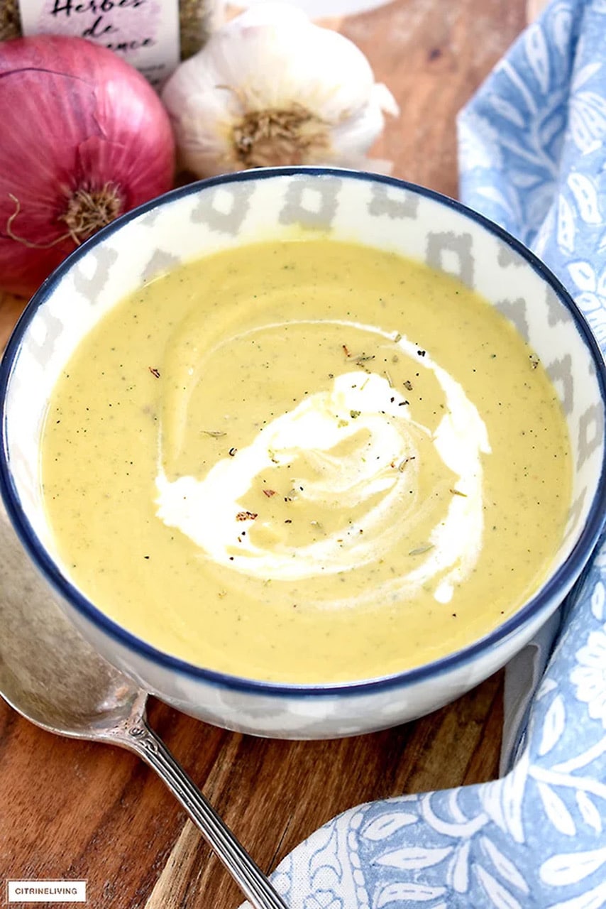 cream of vegetable soup in a blue and white bowl.