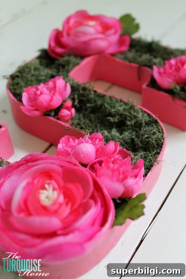 DIY Floral and Moss Letter Art for Wall Decor 6 Finished floral and moss initial, a sweet nursery accent