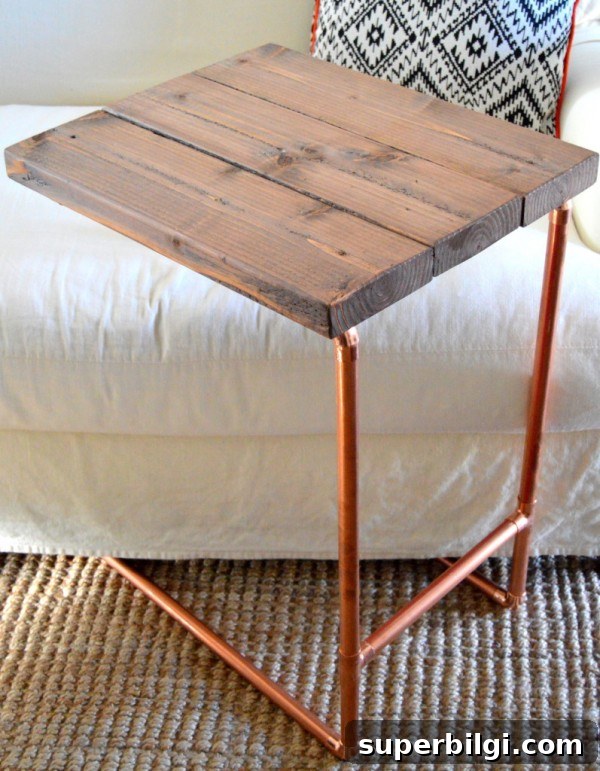 16 Rustic Industrial Home Decor Ideas to Transform Your Space 7 Metal Pipe Laptop Table