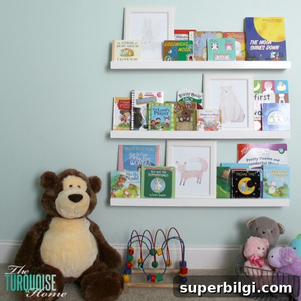 DIY Floating Bookshelf Ledges for Nursery Decor 11 Finished nursery bookshelf ledges filled with children's books.