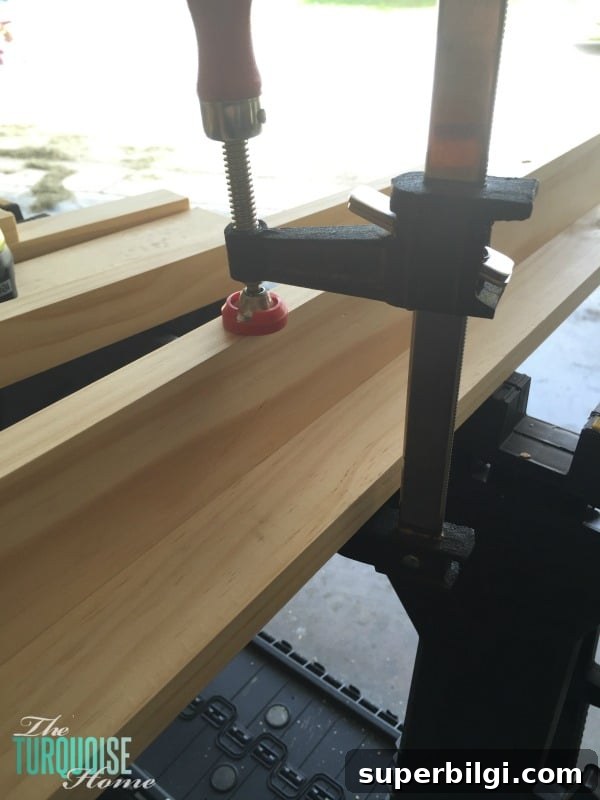 DIY Floating Bookshelf Ledges for Nursery Decor 5 Pocket holes drilled in board for joining ledge pieces.