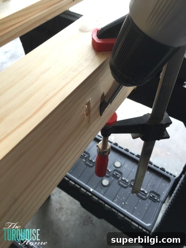 DIY Floating Bookshelf Ledges for Nursery Decor 6 Assembling the ledge by clamping and screwing boards together.