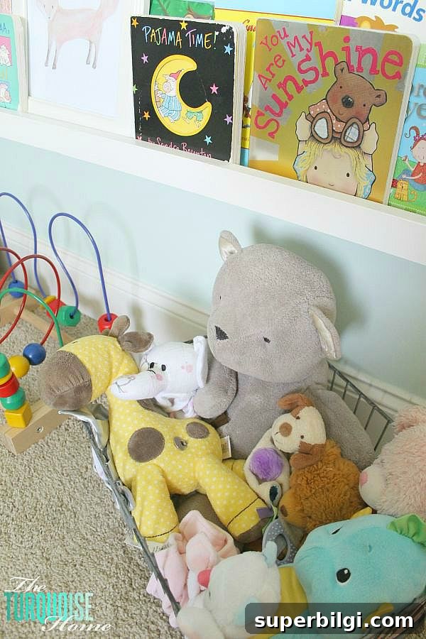 Baby Girl Woodland Nursery Reveal: Complete Tour 14 All of the pretty pink and turquoise touches with a woodland theme make a sweet retreat for any little girl. | Baby Girl's Woodland Nursery | All the details at TheTurquoiseHome.com