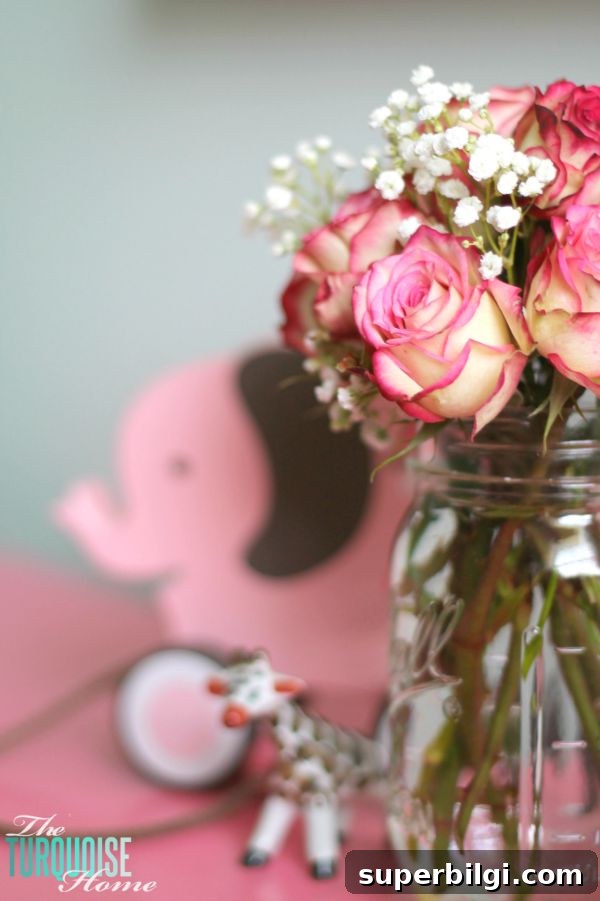 Baby Girl Woodland Nursery Reveal: Complete Tour 16 All of the pretty pink and turquoise touches with a woodland theme make a sweet retreat for any little girl. | Baby Girl's Woodland Nursery | All the details at TheTurquoiseHome.com