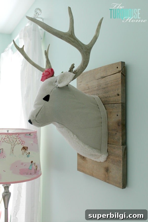 Baby Girl Woodland Nursery Reveal: Complete Tour 7 All of the pretty pink and turquoise touches with a woodland theme make a sweet retreat for any little girl. | Baby Girl's Woodland Nursery | All the details at TheTurquoiseHome.com