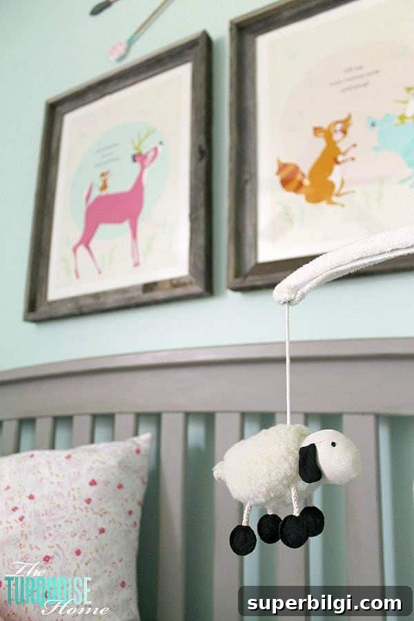Baby Girl Woodland Nursery Reveal: Complete Tour 9 All of the pretty pink and turquoise touches with a woodland theme make a sweet retreat for any little girl. | Baby Girl's Woodland Nursery | All the details at TheTurquoiseHome.com