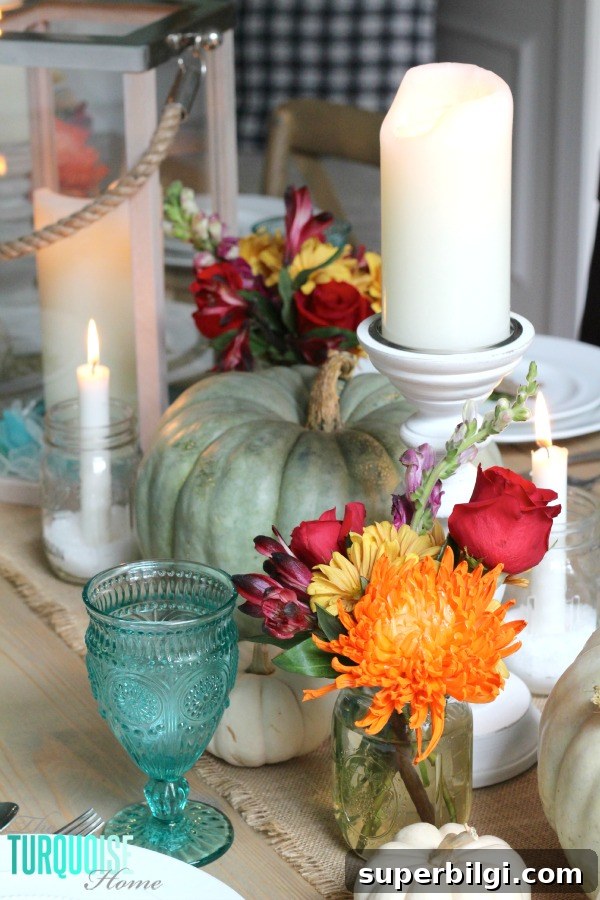 Turquoise Thanksgiving Tablescape Ideas for a Chic Holiday Table 2 Gorgeous! This pretty, colorful fall or Thanksgiving tablescape is just beautiful with pops of turquoise, orange and red! And those beautiful goblets are my fave!