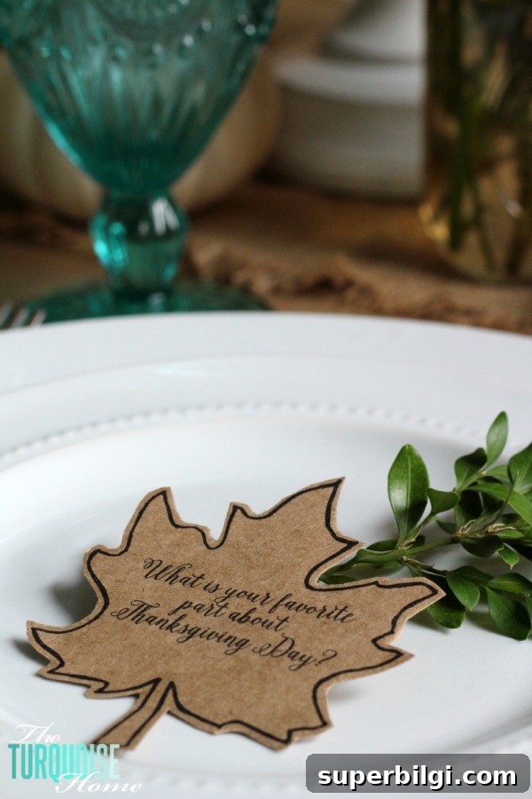 Turquoise Thanksgiving Tablescape Ideas for a Chic Holiday Table 9 Gorgeous! This pretty, colorful fall or Thanksgiving tablescape is just beautiful with pops of turquoise, orange and red! And those beautiful goblets are my fave!