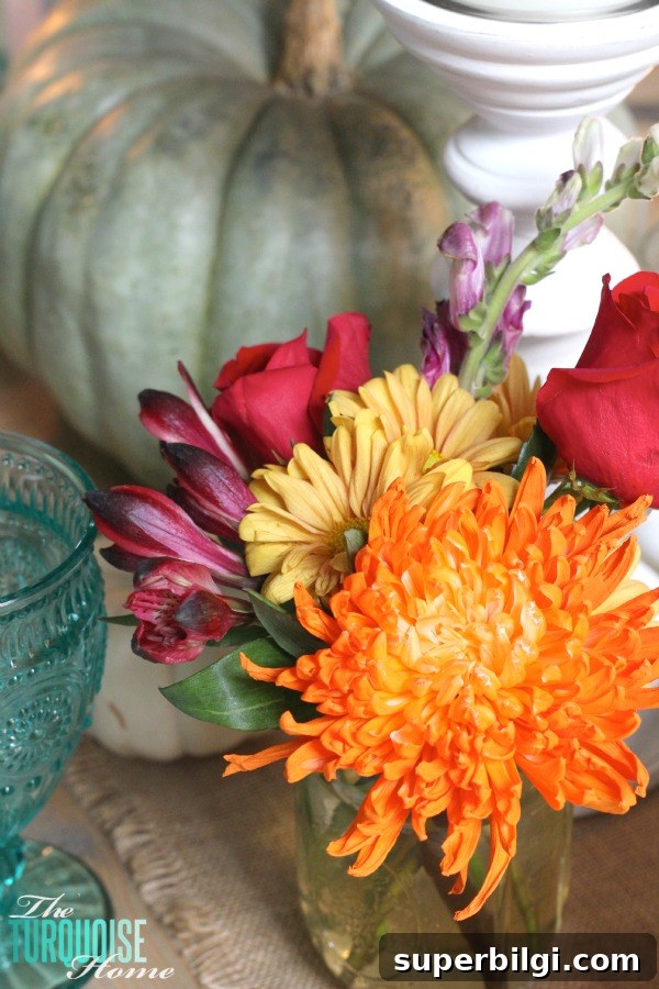 Turquoise Thanksgiving Tablescape Ideas for a Chic Holiday Table 10 Gorgeous! This pretty, colorful fall or Thanksgiving tablescape is just beautiful with pops of turquoise, orange and red! And those beautiful goblets are my fave!