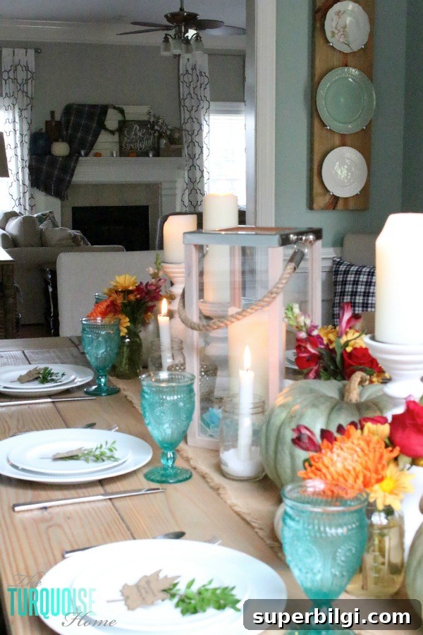 Turquoise Thanksgiving Tablescape Ideas for a Chic Holiday Table 7 Gorgeous! This pretty, colorful fall or Thanksgiving tablescape is just beautiful with pops of turquoise, orange and red! And those beautiful goblets are my fave!
