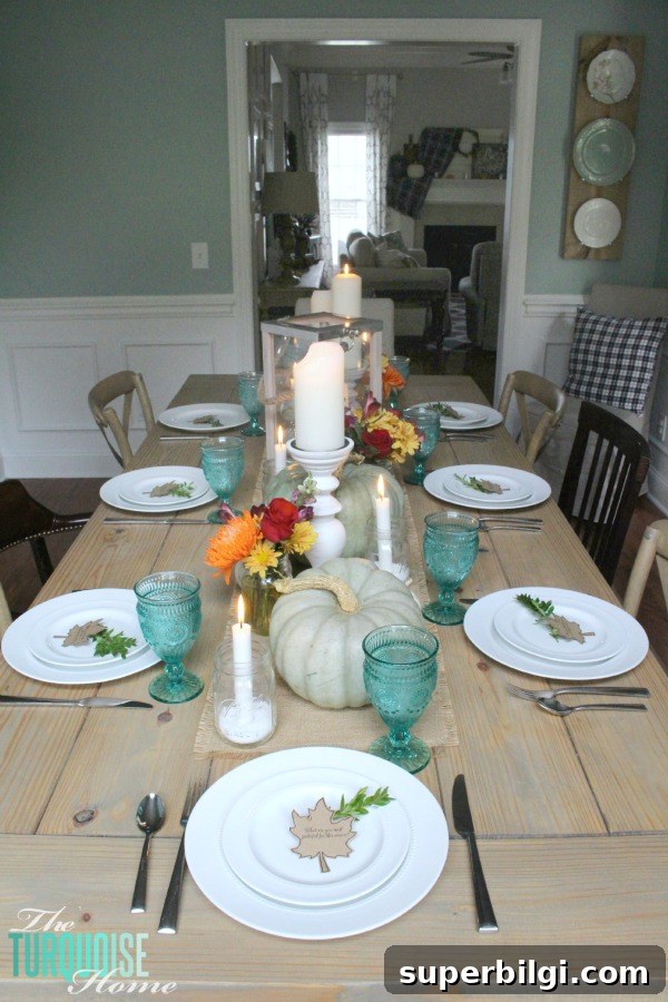 Turquoise Thanksgiving Tablescape Ideas for a Chic Holiday Table 8 Gorgeous! This pretty, colorful fall or Thanksgiving tablescape is just beautiful with pops of turquoise, orange and red! And those beautiful goblets are my fave!