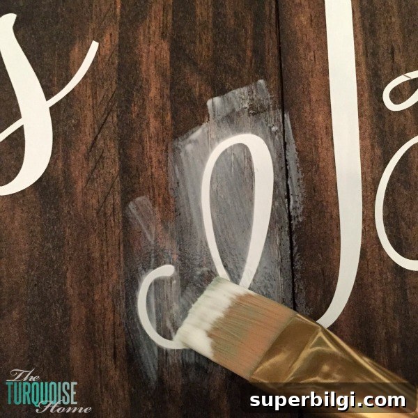 Use this awesome trick with Mod Podge to give a clean crisp line when painting over vinyl. Full tutorial at TheTurquoiseHome.com