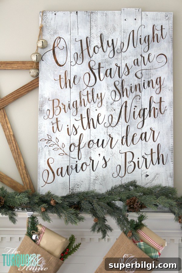 Personalize your Christmas decor with a DIY lettered pallet sign! Full tutorial at TheTurquoiseHome.com