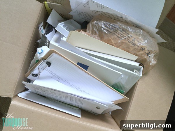 How to Declutter Books and Papers Using the KonMari Method 8 Boxes of papers needing to be decluttered