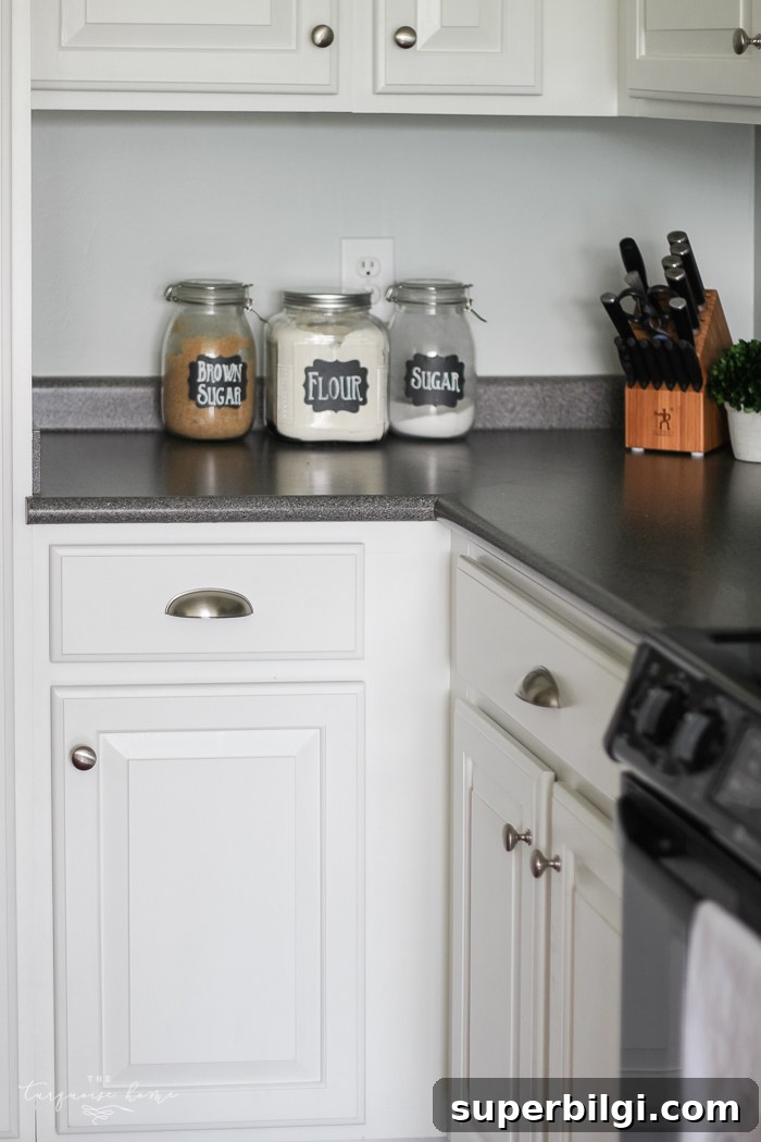 How to Measure and Install Cabinet Pulls for Perfect Alignment 6 Finished drawer pulls installed on painted white cabinetry