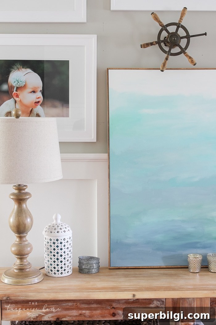 Create a Photo Gallery Wall: Layouts, Styling & Hanging Tips 2 Simple, large photos create a unified photo gallery wall in the living room!
