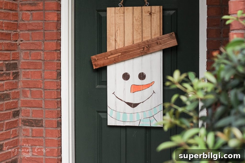 How to Make a Rustic Snowman Door Hanger for Winter 7 DIY Rustic Snowman Door Hanger #dihworkshop