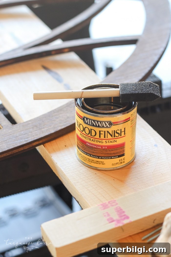 DIY Cathedral Window Frame for Your Fixer-Upper 5 Step 1: stain your window frame | LOVE this look for less! DIY Fixer Upper-style Cathedral Window Frame