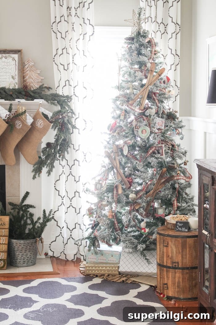 Pretty magnolia wreath Christmas mantel decor brings a rustic feel to the holiday season. Pops of navy and dusty blue are festive, yet unexpected!