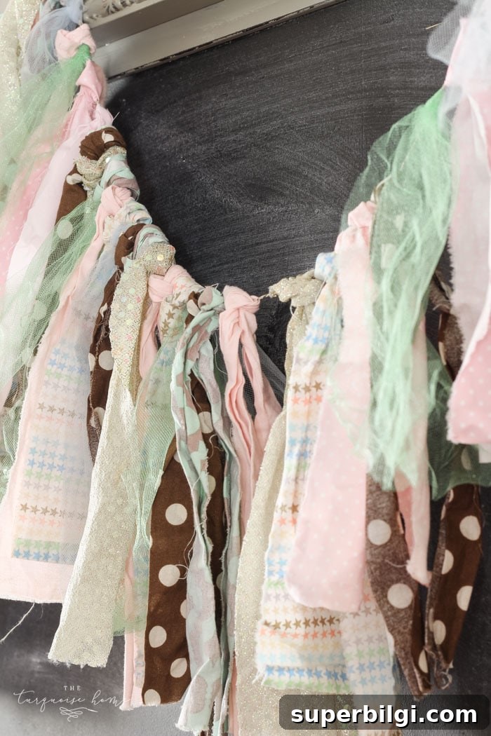 DIY Spring Rag Garland: Charming Step-by-Step Tutorial 5 Tie fabric strips around a length of twine to form a rag garland.
