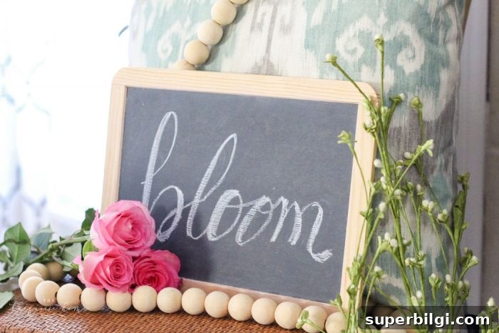 Isn't this just the prettiest pink and turquoise mantel?! Simple Floral Spring Mantel