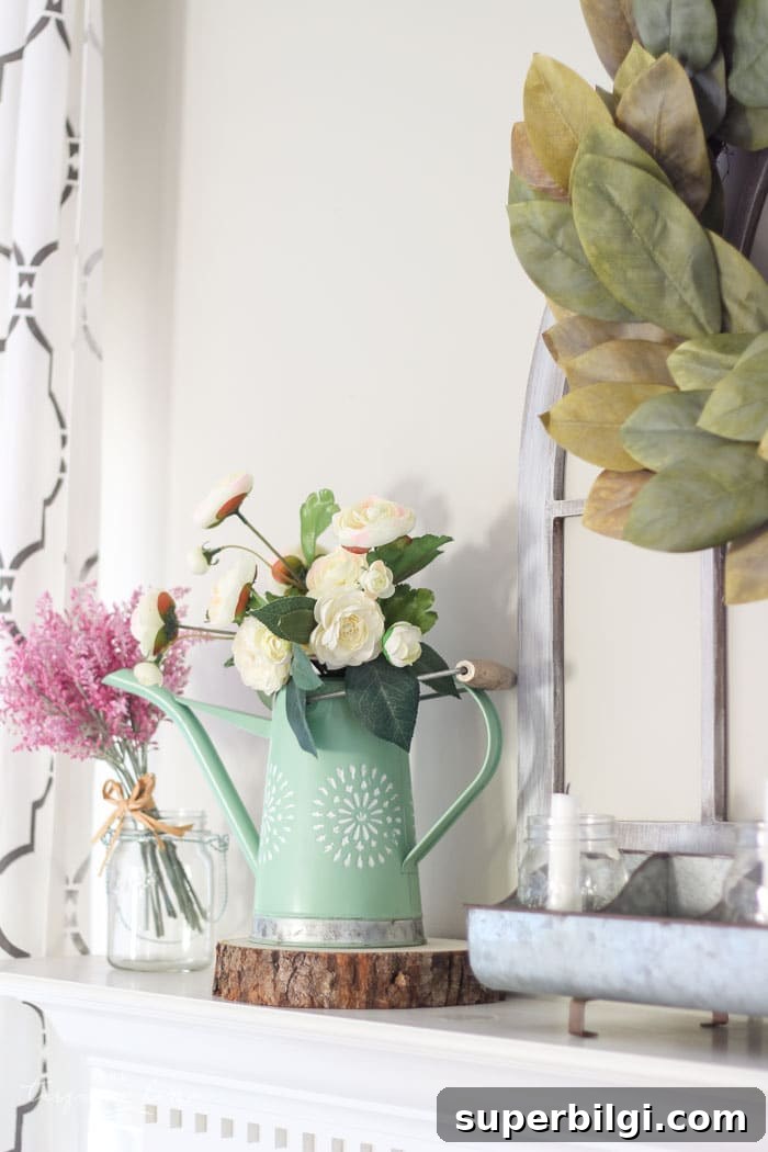 Isn't this just the prettiest pink and turquoise mantel?! Simple Floral Spring Mantel