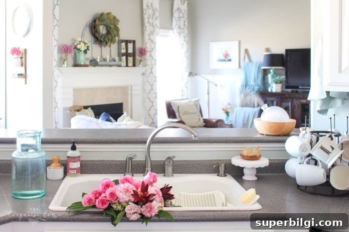 Isn't this just the prettiest pink and turquoise mantel?! Simple Floral Spring Mantel